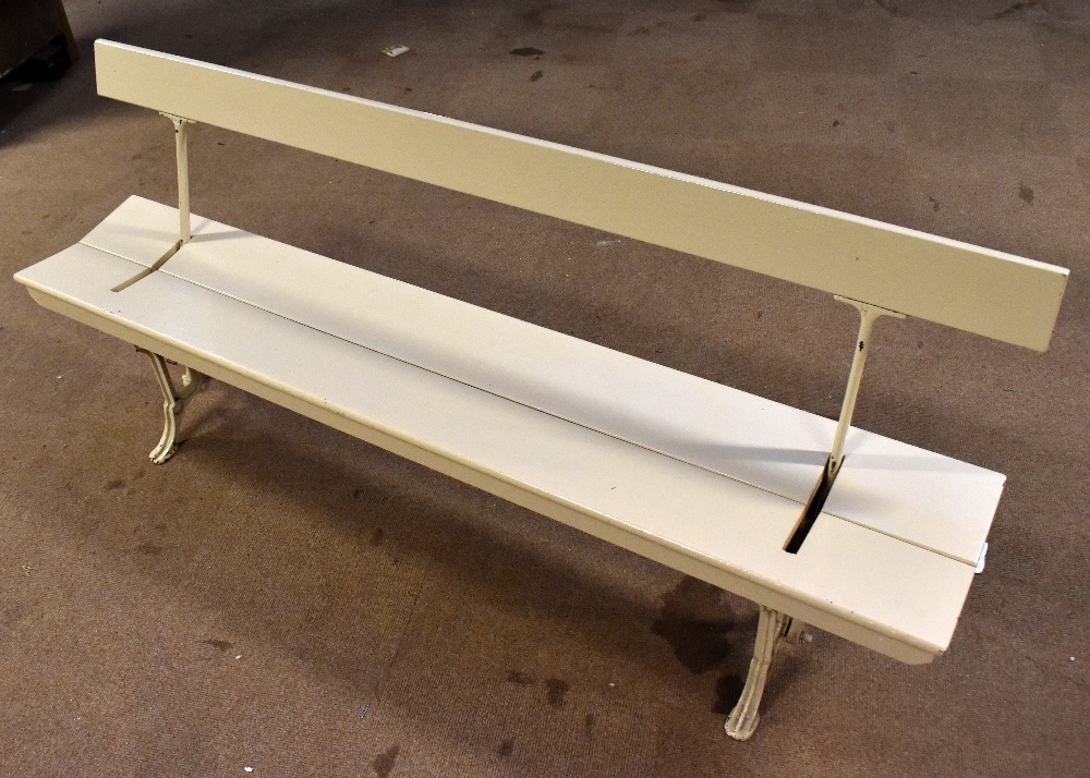 JOHN HEYWOOD LTD, MANCHESTER; a white painted cast iron adjustable railway bench with wooden back