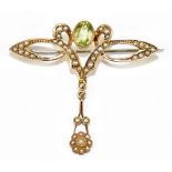 An early 20th century 9ct yellow gold seed pearl and green peridot Art Nouveau bar brooch, length