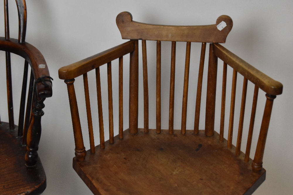 An 18th century elm and yew wood low Windsor armchair with crinoline stretcher, and a hexagonal - Image 3 of 4