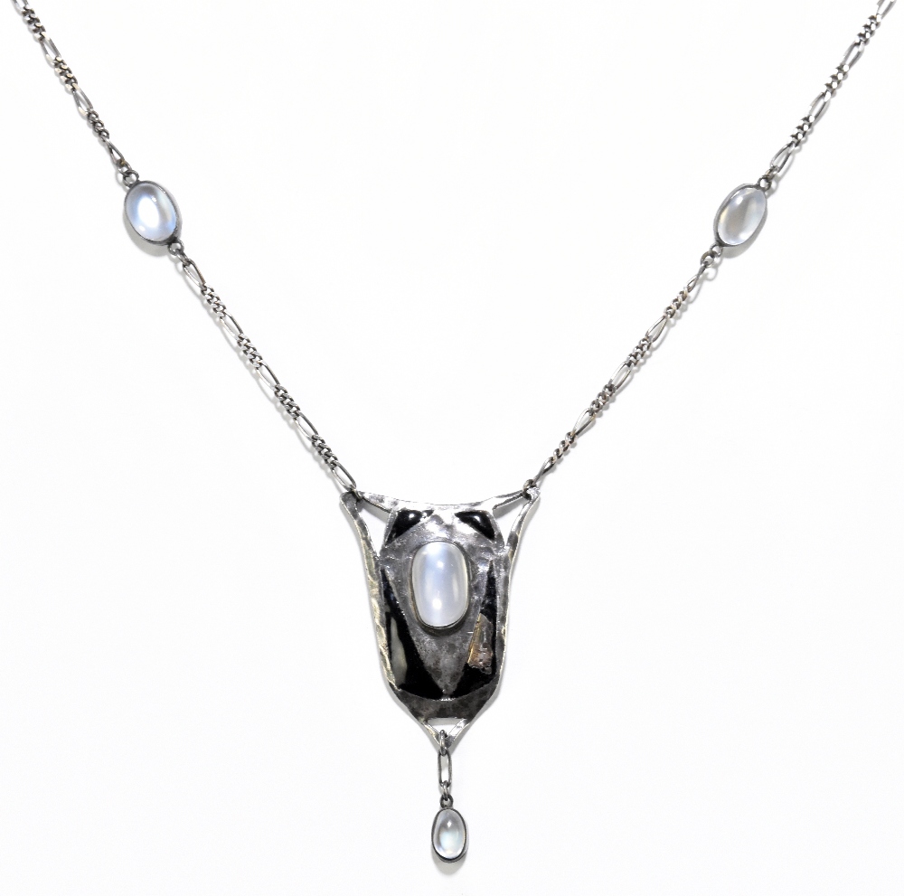 An Art Nouveau style white metal black enamelled and moonstone set necklace, with fetter and curb