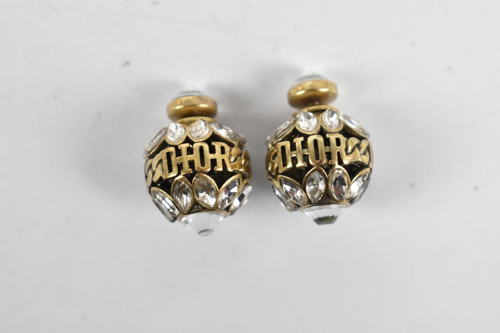 CHRISTIAN DIOR; a pair of gold tone Tribales pierced earrings with maker's logo around a sphere of - Image 3 of 3