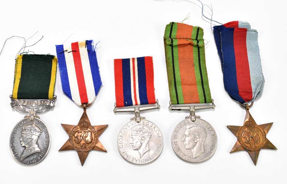 A WWI Territorial medal for efficient service, awarded to Gunner J.W. Whitley R.A. together with