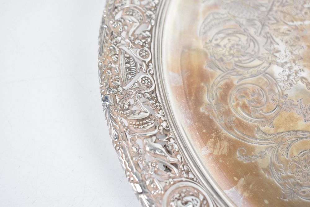 A 19th century white metal circular salver with engraved centre and pierced border, decorated with - Image 3 of 5