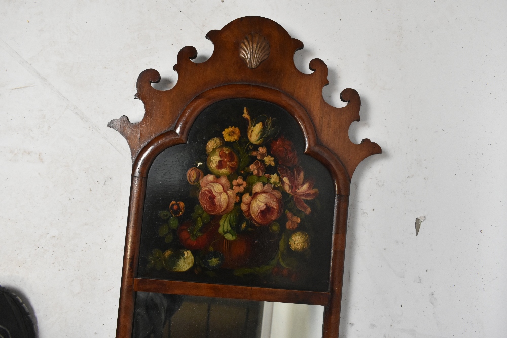 A Georgian style walnut framed wall mirror with carved inset panel, oil, still life, length 110cm. - Image 2 of 2