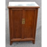 A modern Chinese marble top cupboard, of tapering form, with two doors, height 107cm, width 68cm,