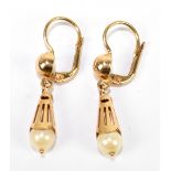 A pair of 18ct yellow gold and cultured pearl drop earrings, length approx 28mm and combined 3.7g.