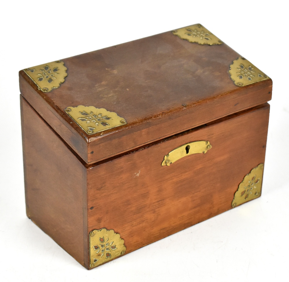 An Edwardian oak and brass mounted stationery box with sloping hinged lid, width 23cm.