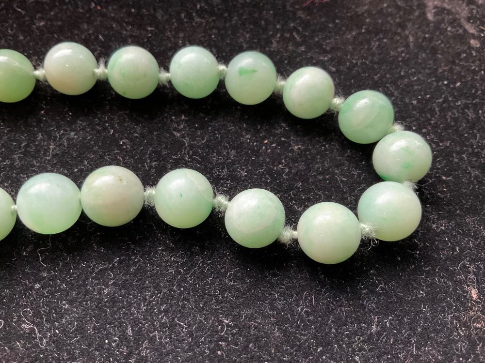 A 1920s/30s jade bead necklace, re-strung and with modern ring loop fastener, length 46cm, each bead - Image 7 of 8