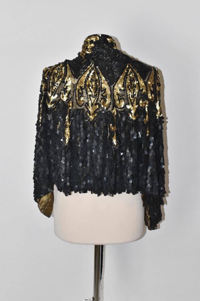 A 1930s gold metallic knit short shoulder cape covered in black lace embellished with large black - Image 2 of 4