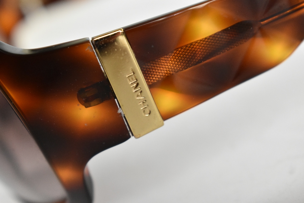 CHANEL; a pair of authentic tortoiseshell style sunglasses with quilted effect arms, maker's logo to - Image 3 of 3