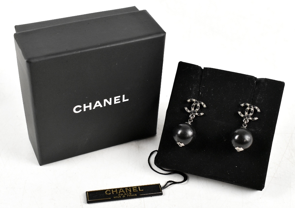 CHANEL; a pair of authentic 'CC' pierced earrings set in Ruthenium metal, stamped 'Chanel' to