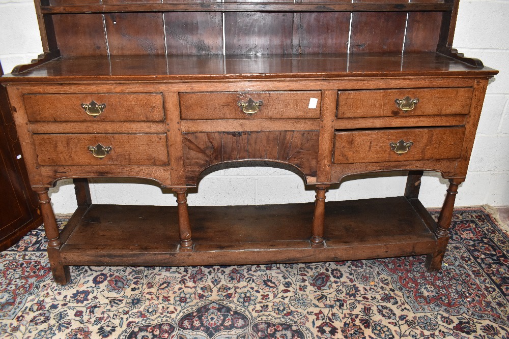 An 18th century oak dresser with boarded plate rack back with five drawers raised on block feet, - Image 2 of 4