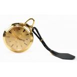 BUCHERER; a gold plated alarm pocket watch, with ring loop attachment and baton markers to the dial,