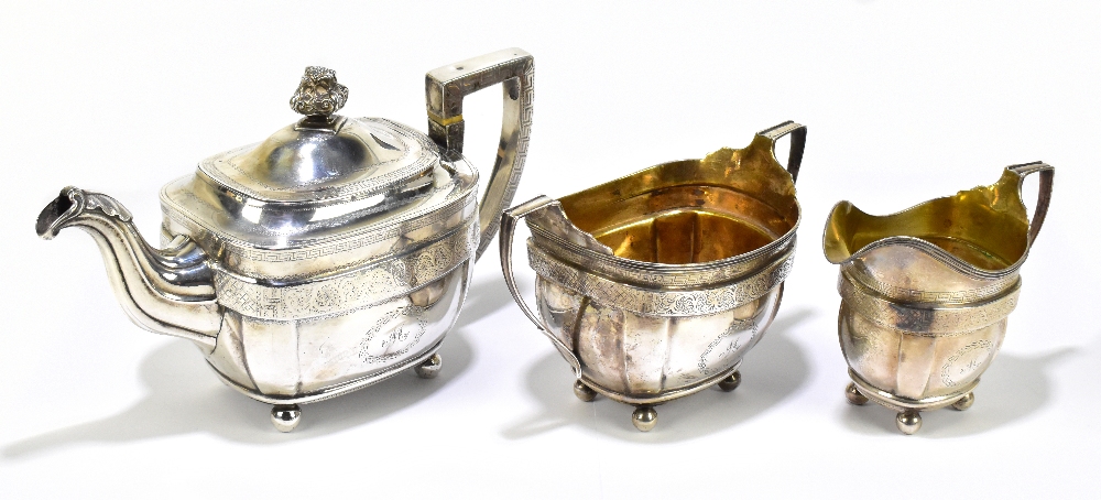 MATTHEW CRAW (probably); a George III hallmarked silver three piece tea service, the teapot cover