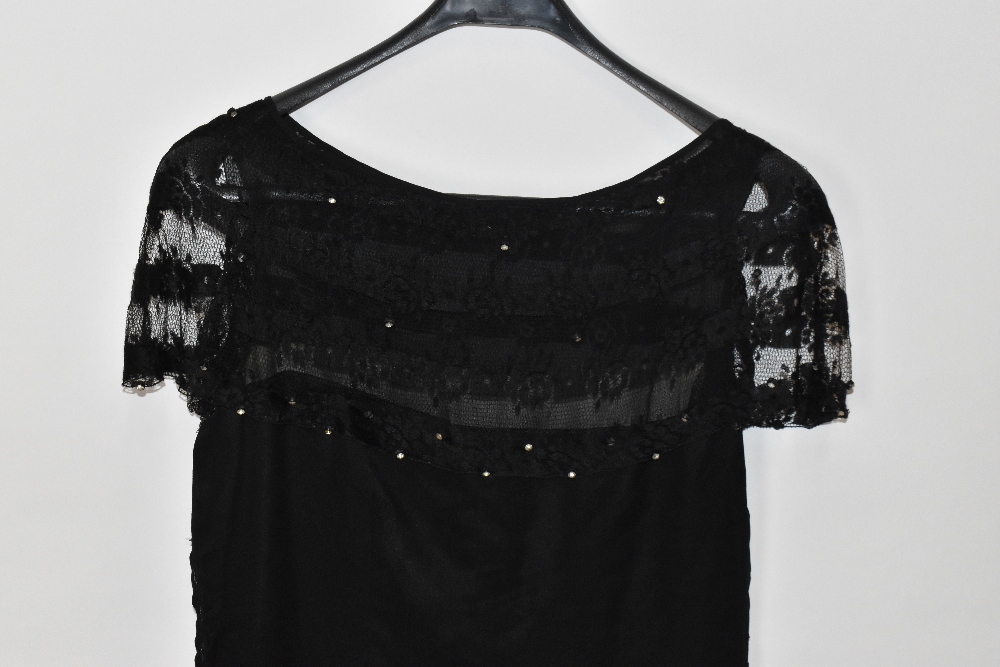 A 1920s black silk and handmade lace evening dress lined with silk with a swag hem embellished - Image 2 of 4