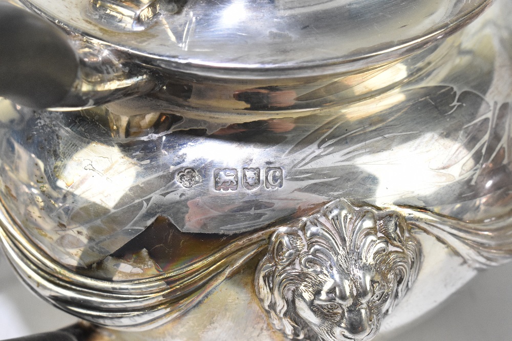 CARRINGTON & CO; a Victorian hallmarked silver four piece tea service with cast ribbons, lion mask - Image 4 of 5