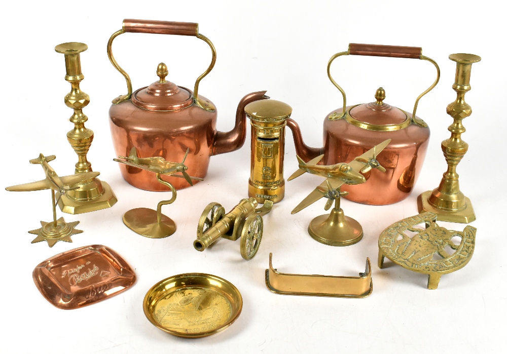 An assortment of 19th century and later metalware including two copper kettles, Trench Art planes, a