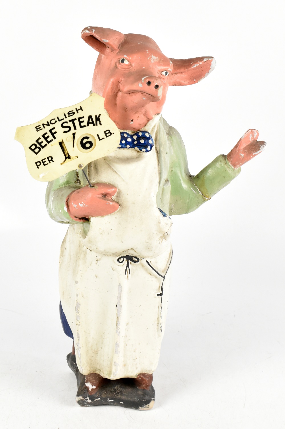 A vintage painted composite advertising shop display figure representing a standing pig dressed in a