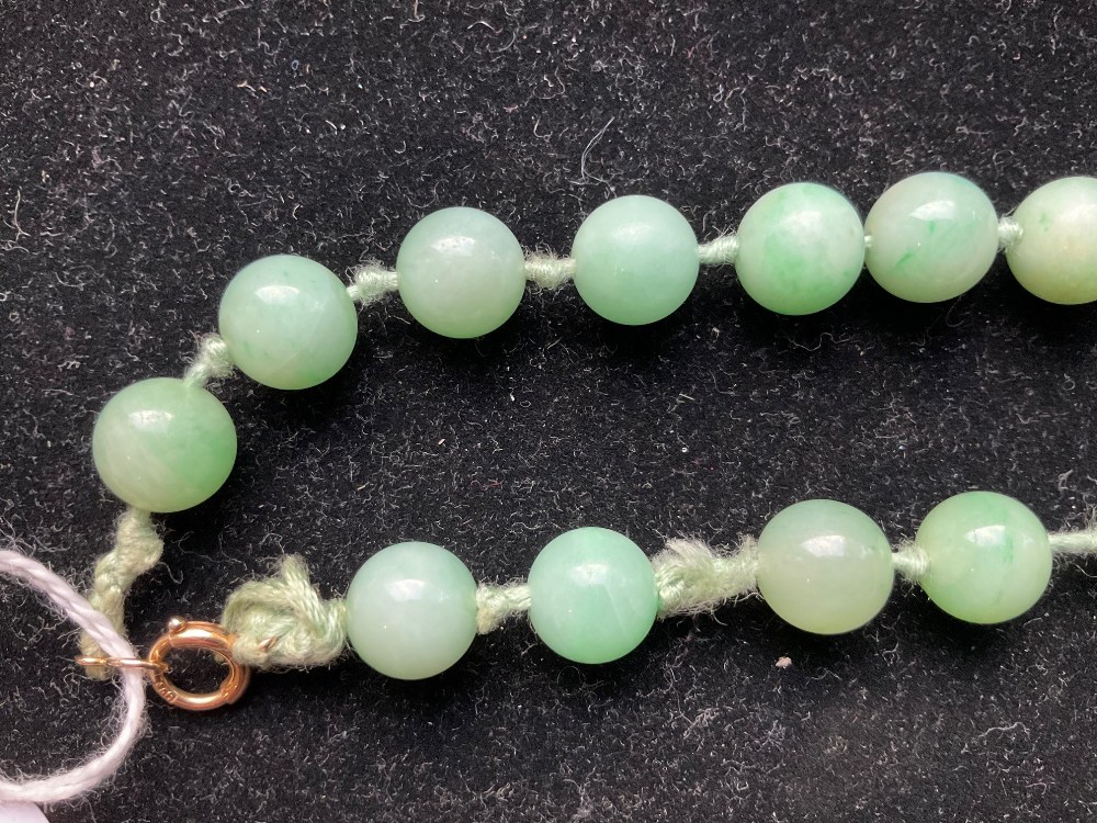 A 1920s/30s jade bead necklace, re-strung and with modern ring loop fastener, length 46cm, each bead - Image 3 of 8