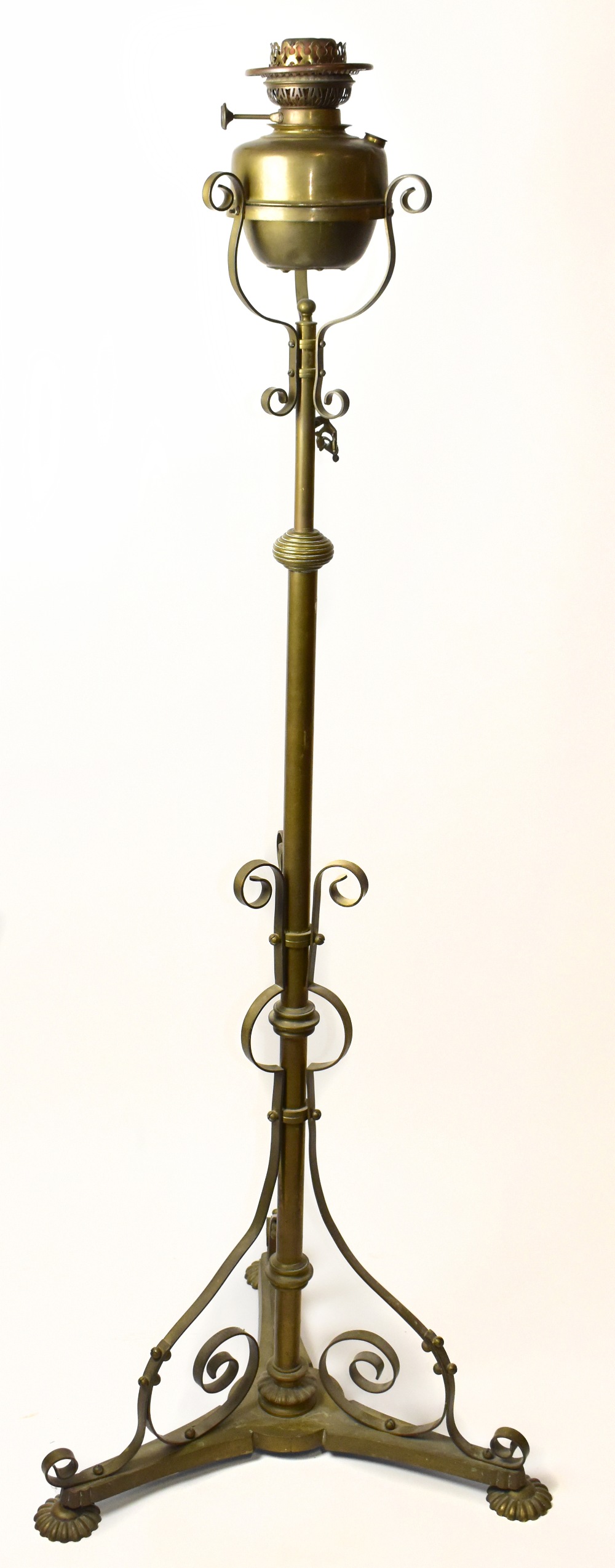 A late 19th century brass adjustable telescopic standard oil lamp.