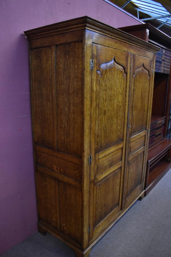 A good quality reproduction oak cupboard, probably by Titchmarsh & Goodwin, with pair of panel doors - Image 2 of 3