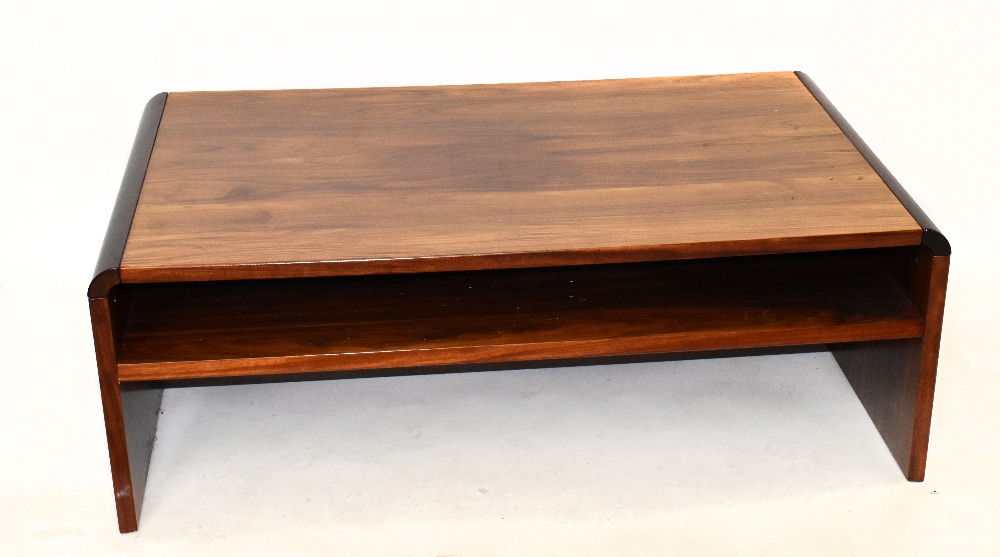 MANNER OF JENSEN FROKJAERAS; a 1970's Danish rosewood coffee table, with curved edges, height