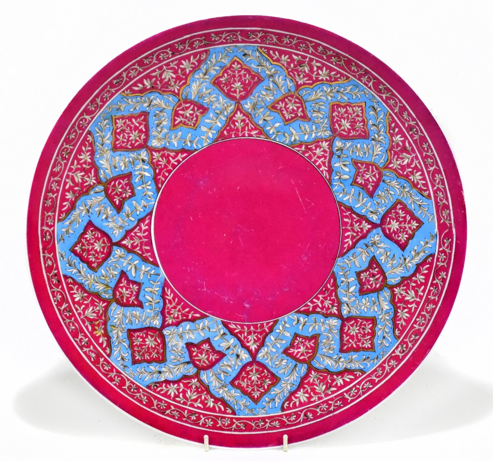 A. GARDNER; a Russian circular wall charger with floral decoration and gilded highlights, printed