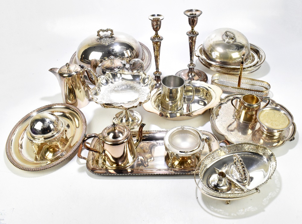 A collection of 19th century and later silver plated items, to include a pair of candlesticks,