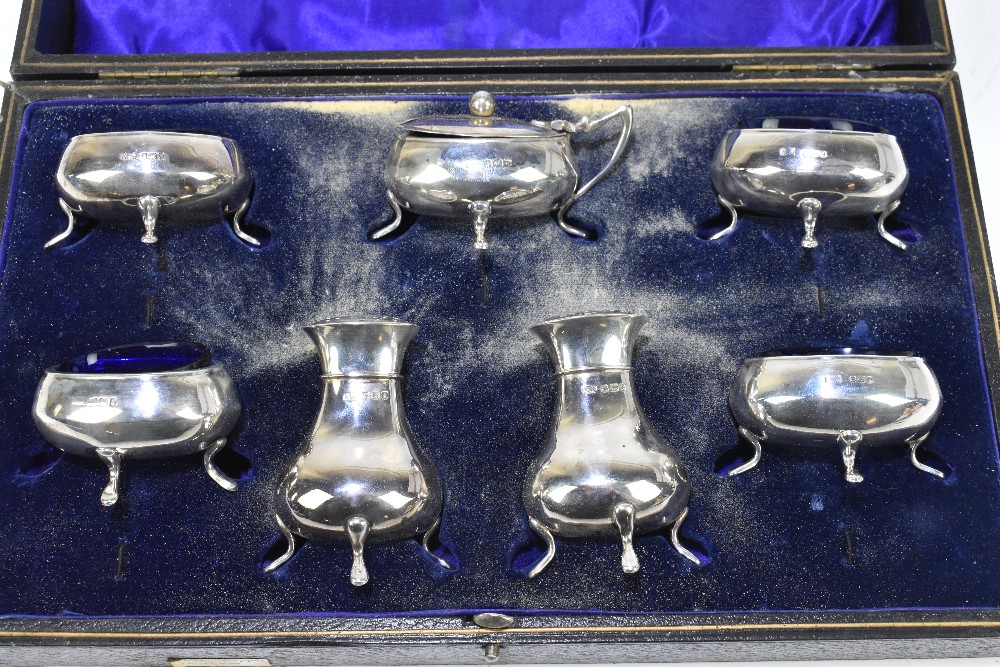 RF MOSLEY; a George V hallmarked silver seven piece cruet comprising four open salts, a lidded - Image 2 of 3