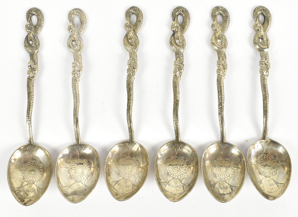 A set of six Chinese white metal teaspoons with stylised dragon pierced handles and elaborate