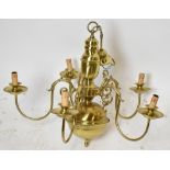 A reproduction brass Dutch style five branch chandelier.