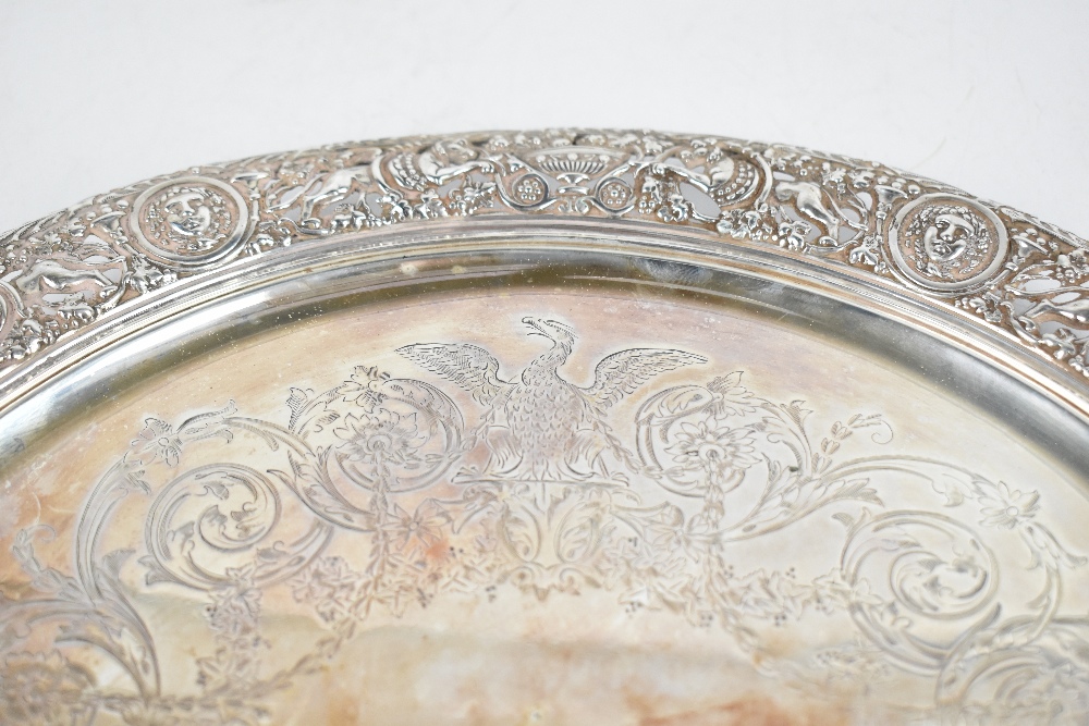 A 19th century white metal circular salver with engraved centre and pierced border, decorated with - Image 2 of 5