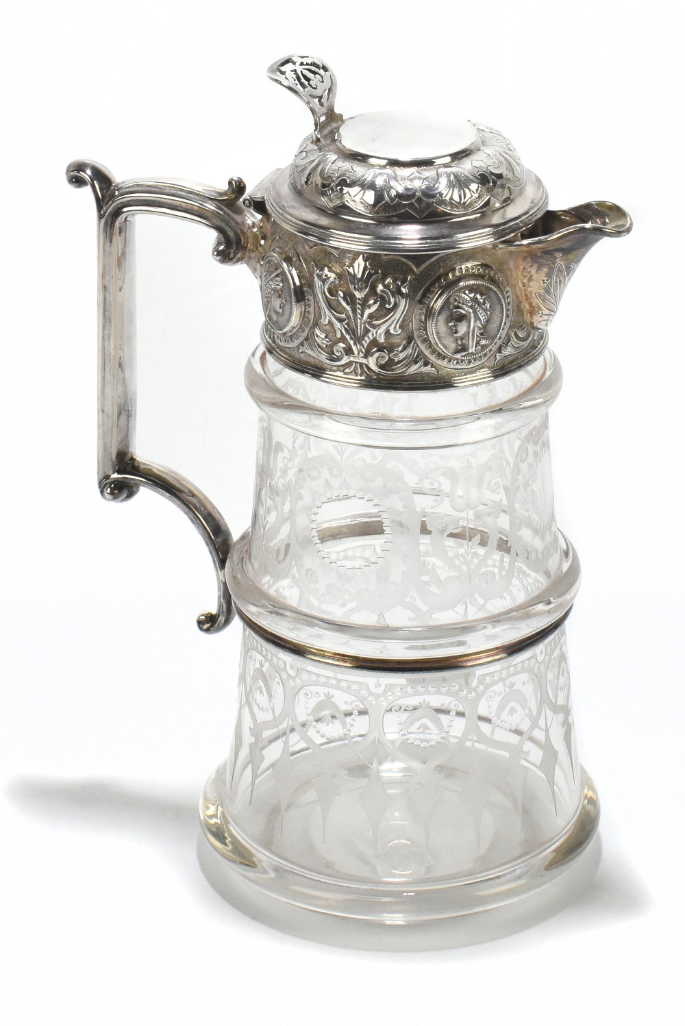 W & G SISSONS; a Victorian hallmarked silver mounted claret jug, the clear glass body with etched