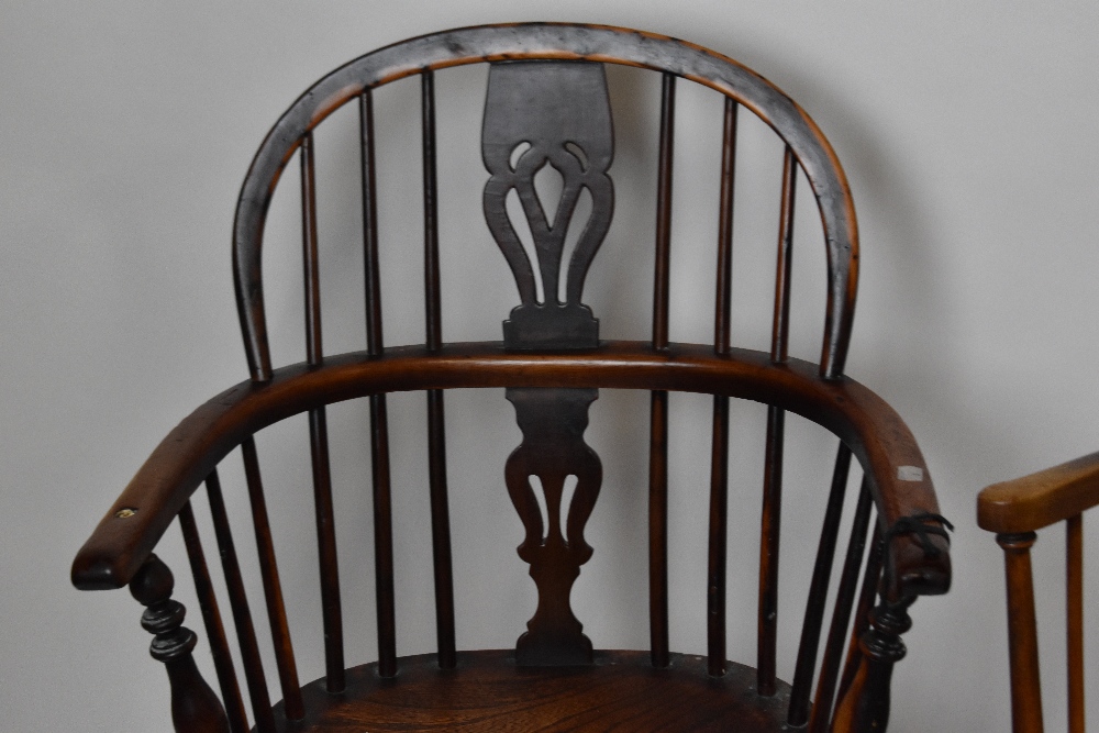 An 18th century elm and yew wood low Windsor armchair with crinoline stretcher, and a hexagonal - Image 2 of 4