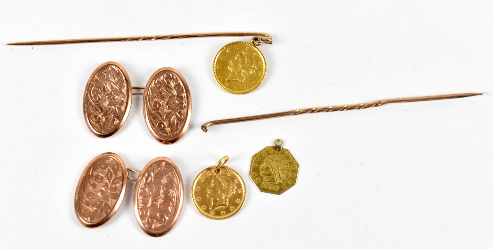 A pair of 9ct rose gold cufflinks, approx. 2.8g, a stick pin set with an 1851 $1, a similar