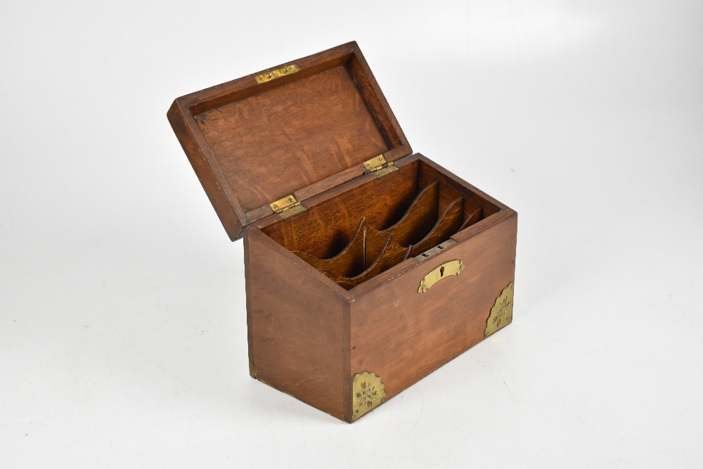 An Edwardian oak and brass mounted stationery box with sloping hinged lid, width 23cm. - Image 2 of 2