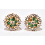 A pair of 18ct yellow gold diamond and emerald set ear studs, each platform 13mm in diameter,