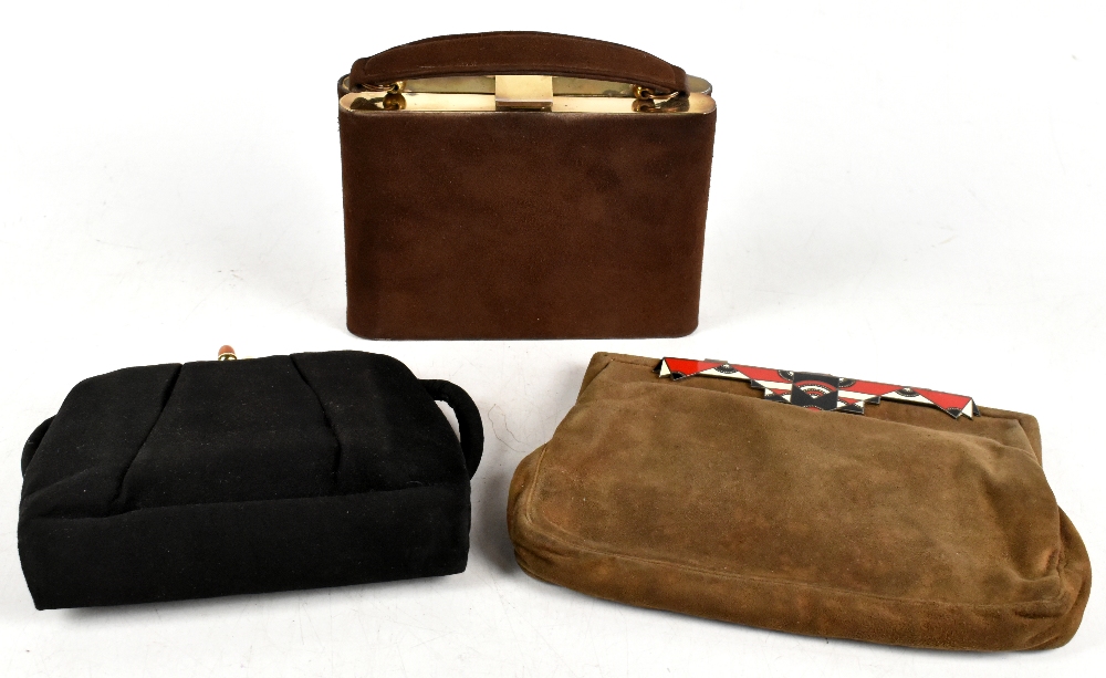 Three vintage handbags including a 1950s Minois France black silk vanity bag, containing a