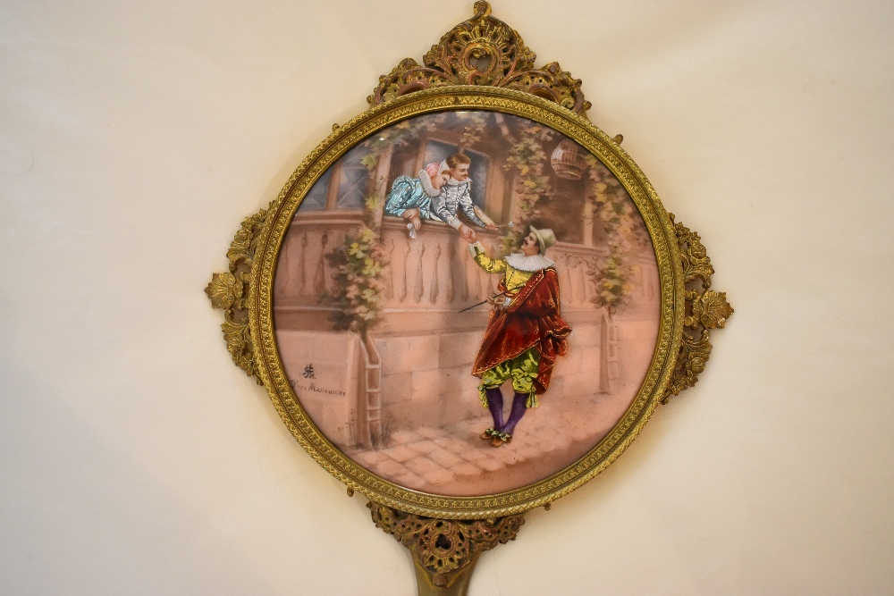 An early 20th century French gilt metal and enamel decorated hand mirror, the back decorated with - Image 2 of 5