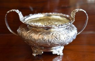 GEORGE HUNTER II; a George IV hallmarked silver and embossed twin handled sugar bowl with traces