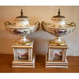 A pair of early/mid-19th century English porcelain potpourri urns on integral stands, both gilt