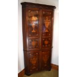 A George III mahogany and satinwood inlaid freestanding flat fronted corner cupboard, the moulded