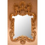 A 20th century carved gilt wood wall mirror with floral pierced shaped frame, height 81cm, width