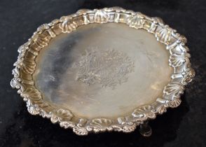 ROBERT REW; a George III hallmarked silver waiter with shell decorated raised border, central