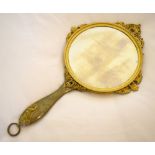 An early 20th century French gilt metal and enamel decorated hand mirror, the back decorated with