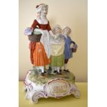 An early 20th century Continental porcelain figure group advertising 'Yardley's Old English