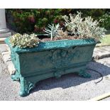 A pair of 19th century green painted cast iron rectangular garden planters in the style of George