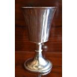 An early white metal goblet with tapering bowl with visible seam above knopped stem and circular