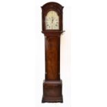 A George III mahogany longcase clock, the domed hood with fret carved panel above arched silvered