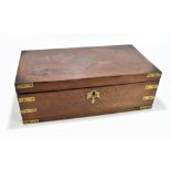 A mid-19th century mahogany and brass mounted campaign writing slope, the hinged lid centred with